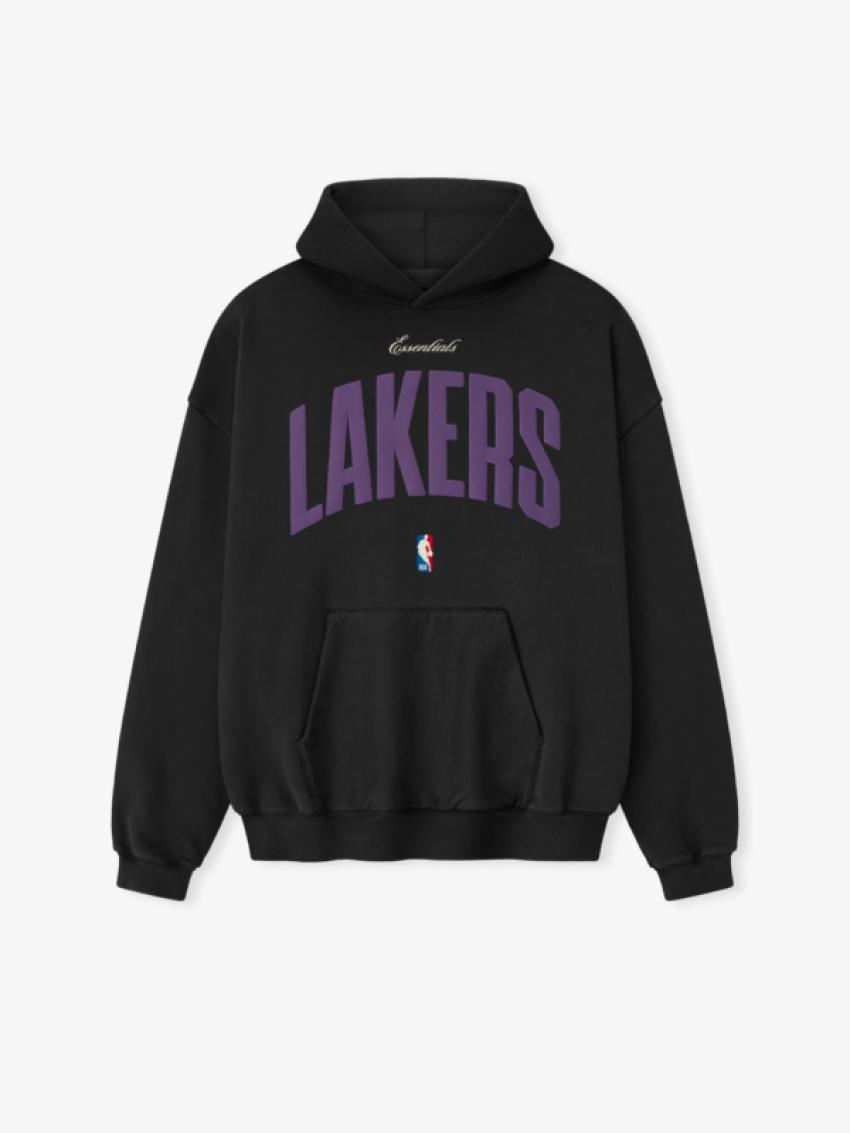 Why is a black Essentials hoodie the ultimate travel garment?